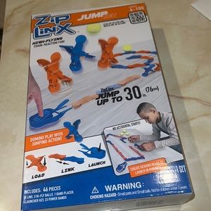 NIB zip Linx Jump Set, for Ages 6 +  Domino Play with Jumping Action